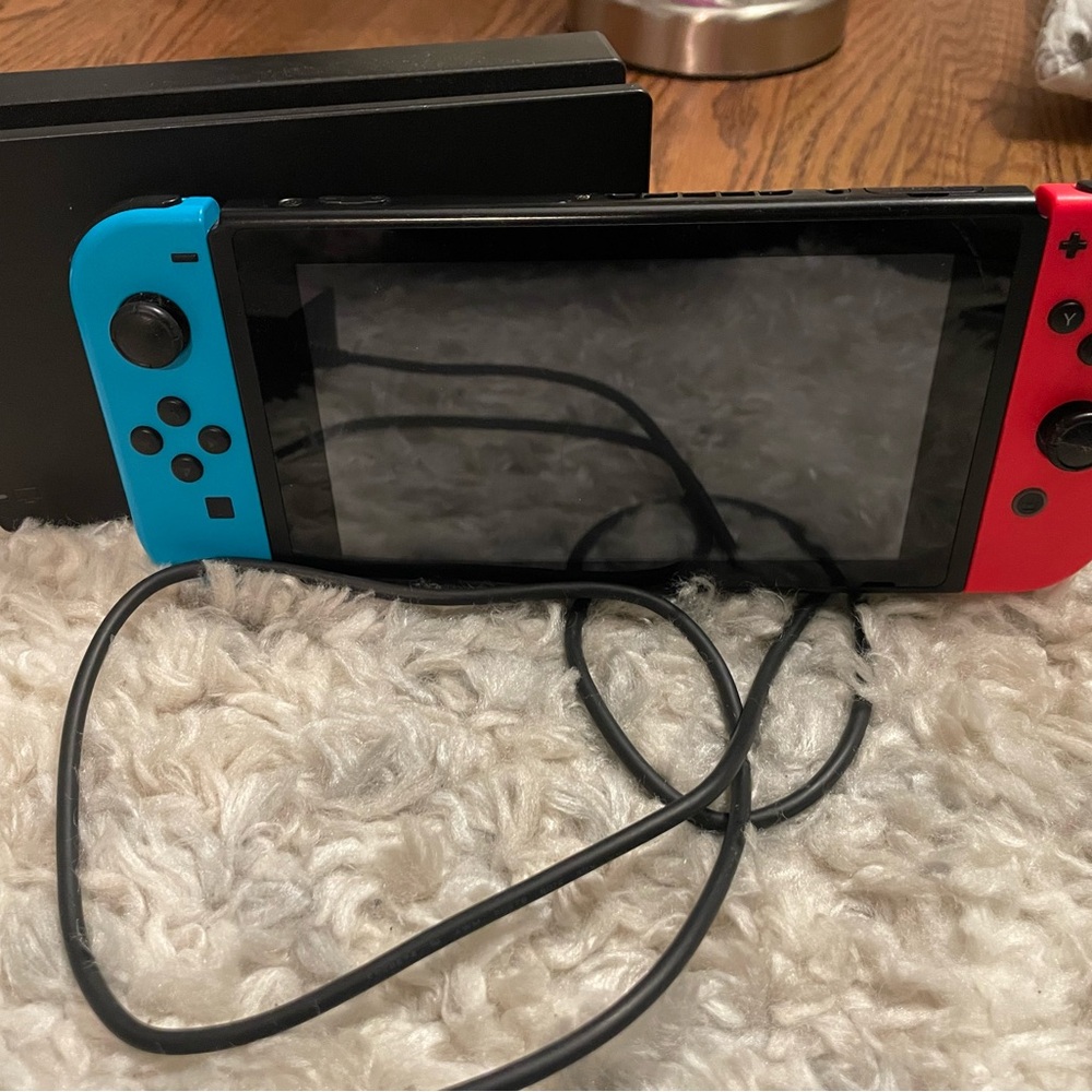 Nintendo Switch with Neon Blue (Left) & Neon Red (Right) Joy-Con